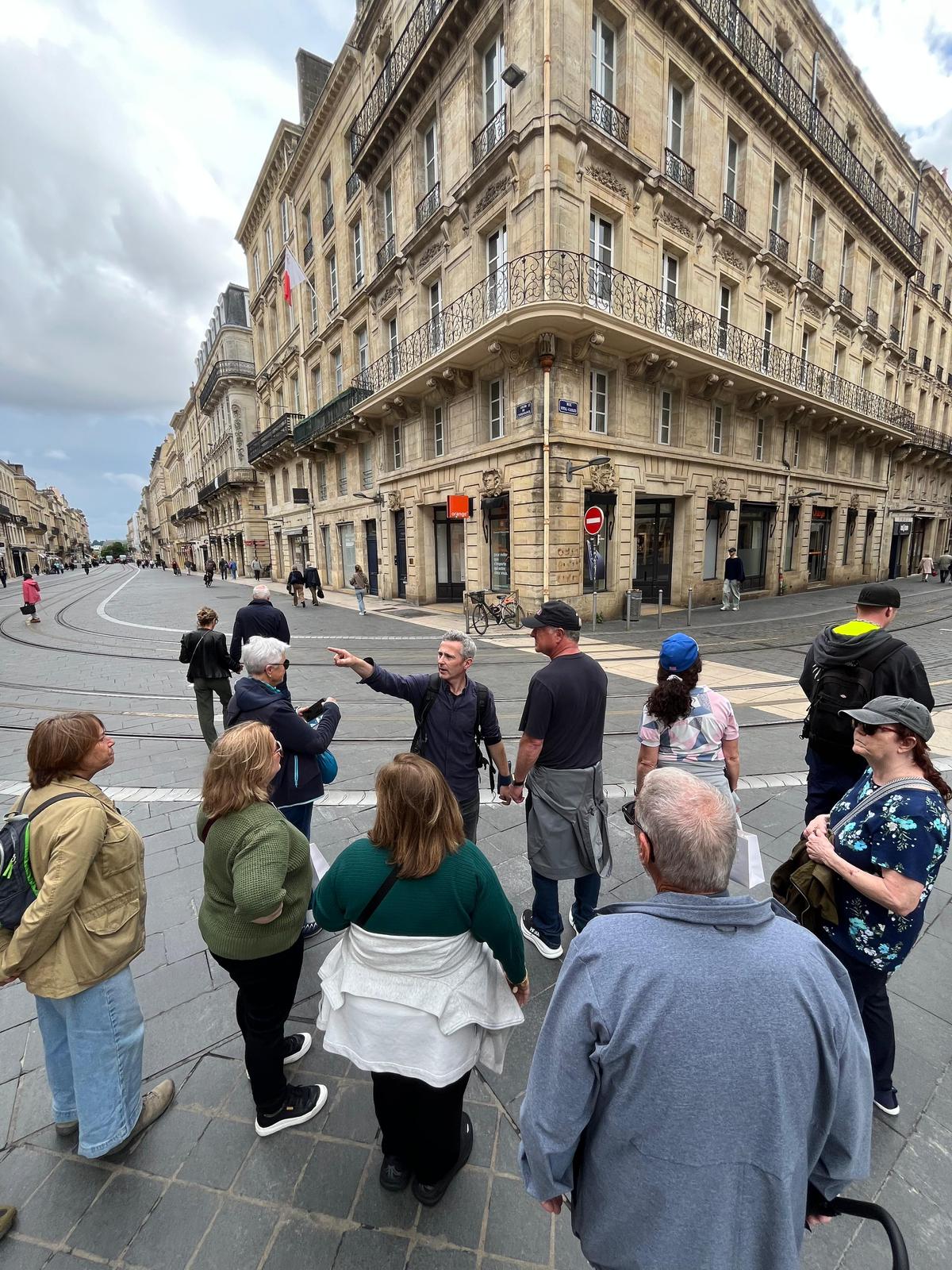 Antoine guiding a group through Bordeaux